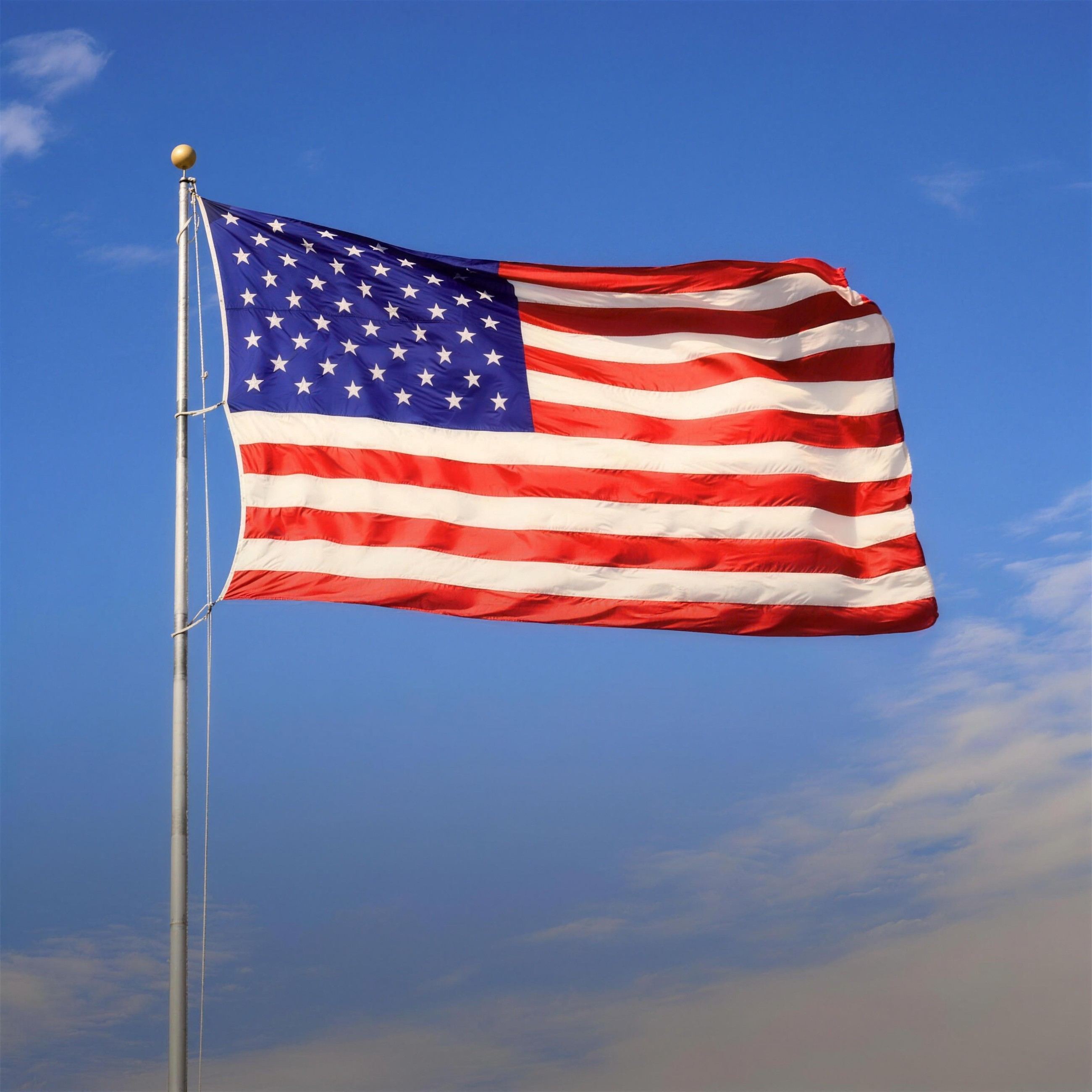 American flag against a blue sky