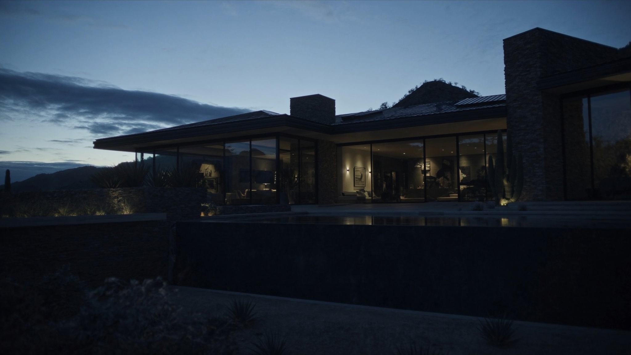 Representative photograph: Modern desert estate with a pool at dusk, mountains behind