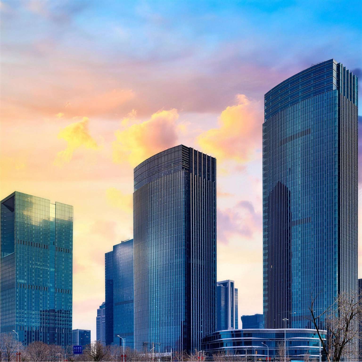 Glass skyscrapers on a skyline at sunset