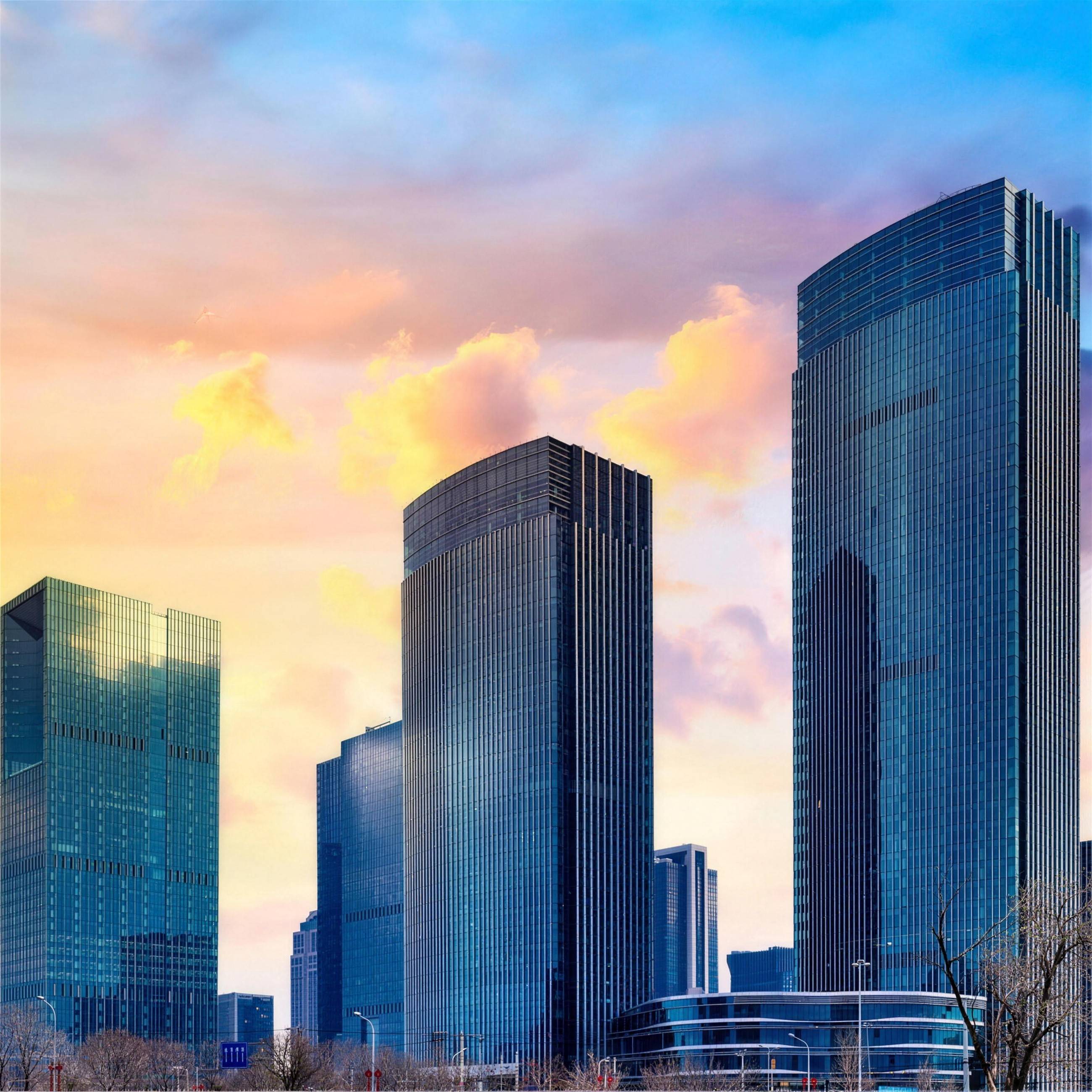 Glass skyscrapers on a skyline at sunset