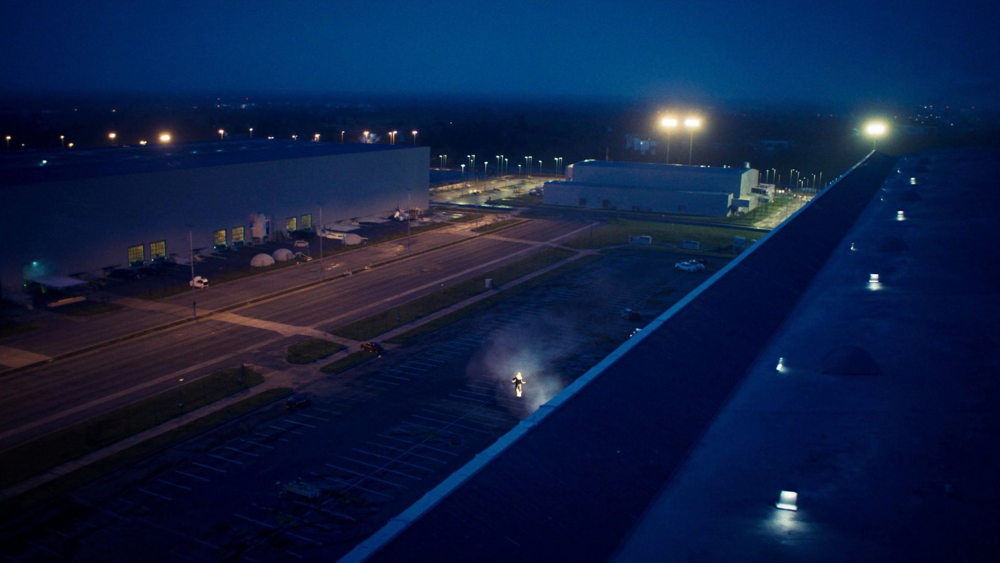Aerial view of a modern warehouse and logistics park at blue hour