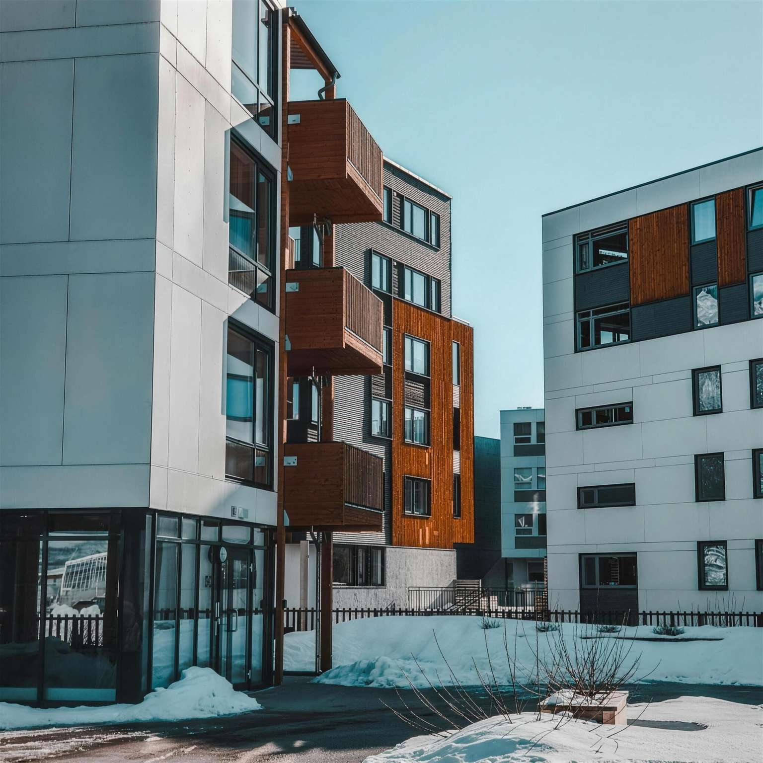 Modern apartment building with wood-clad balconies